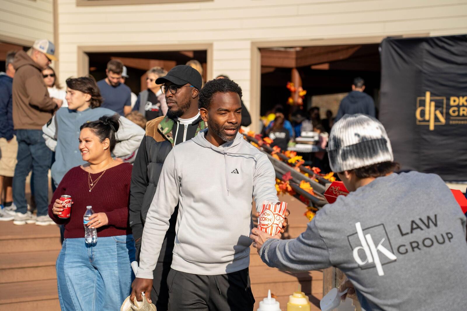 Guests grabbing food at the DK Law Group Fall Festival